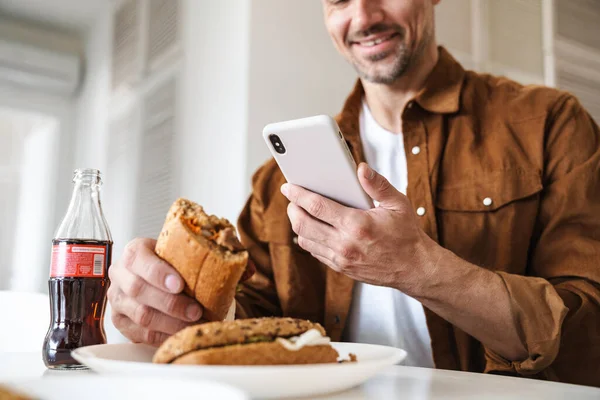 Cropped Image Joyful Man Smiling Using Smartphone While Have Lunch — Stock Photo, Image
