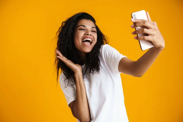 Psmiling Young African Woman Taking Selfie Mobile Phone Yellow Background — Stock Photo, Image