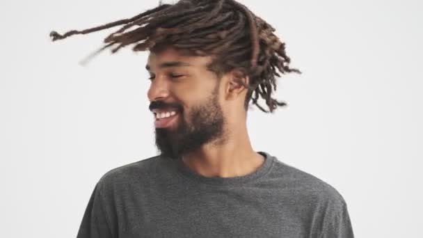 Young African Positive Man Shaking His Hair Dreadlocks Isolated White Stock Video