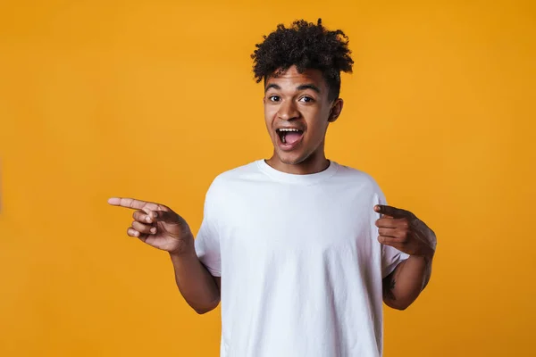 Image Surprised African American Guy Pointing Fingers Aside Isolated Yellow — Stock Photo, Image