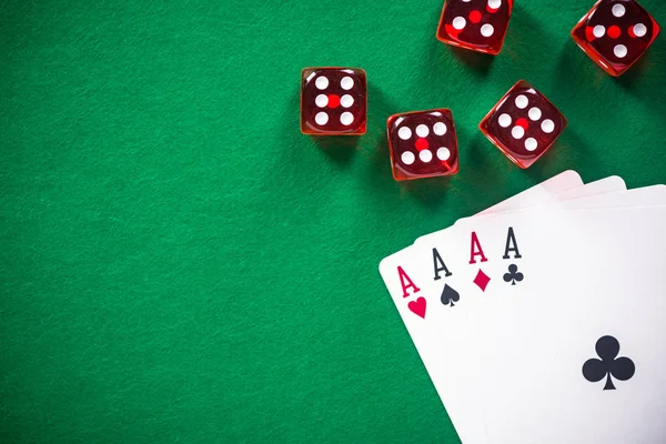 stock image Four aces poker cards and red dices on casino table.