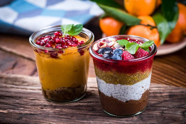 Layered healthy diet food in jars with chia seeds