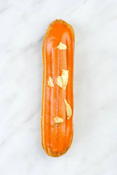 Artisan French Eclair Decorated on White Marble — Stock Photo, Image
