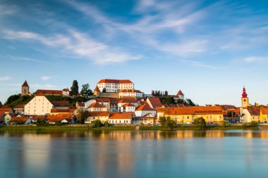 Beautiful City Ptuj in Slovenia at River Bank with Castle on Hil clipart