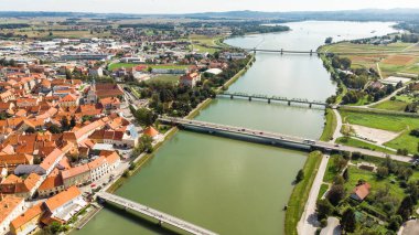 River Drava Aerial Drone View with Old Town of Pruj in Slovenia clipart