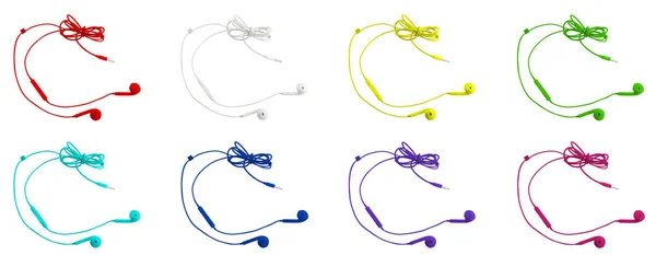 Osm pestrobarevným vakuové sluchátka na bílém pozadí izolované — Stock fotografie