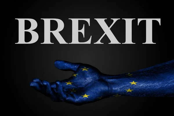 An outstretched hand with a painted EU flag and the word BREXIT, help sign or request, support or poverty on a dark background. — Stock Photo, Image