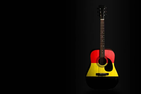 Acoustic concert guitar with a drawn flag Belgium, on a dark background, as a symbol of national creativity or folk song. — Stock Photo, Image