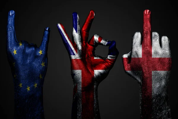 A set of three hands with a painted flag of England, United Kingdom and European Union show middle finger, goat and Okay, a sign of aggression, protest and approval on a dark background. — Stock Photo, Image