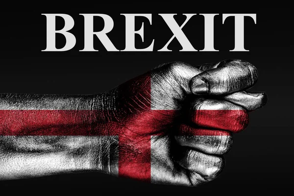 The hand with the painted flag of England depicts a fig and the inscription BREXIT, a sign of aggression, disagreement, a dispute on a dark background. — Stock Photo, Image