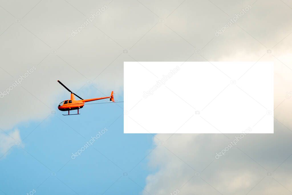 yellow helicopter high in the sky with a white canvas under the mockup.