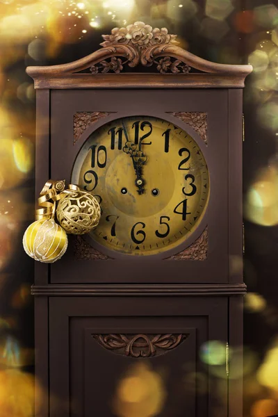 New year background with vintage clock and decorations. Clock countdown five minute time. Golden decoration card, greeting