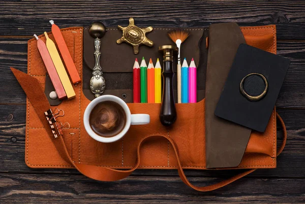 Wax seal, sealing wax, brush and pencils in a leather case