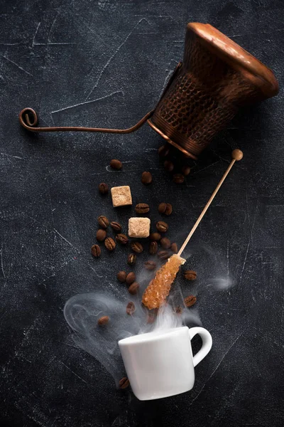 coffee concept. Cezve, coffee beans and sugar ingredients for making coffee, on black background flat lay