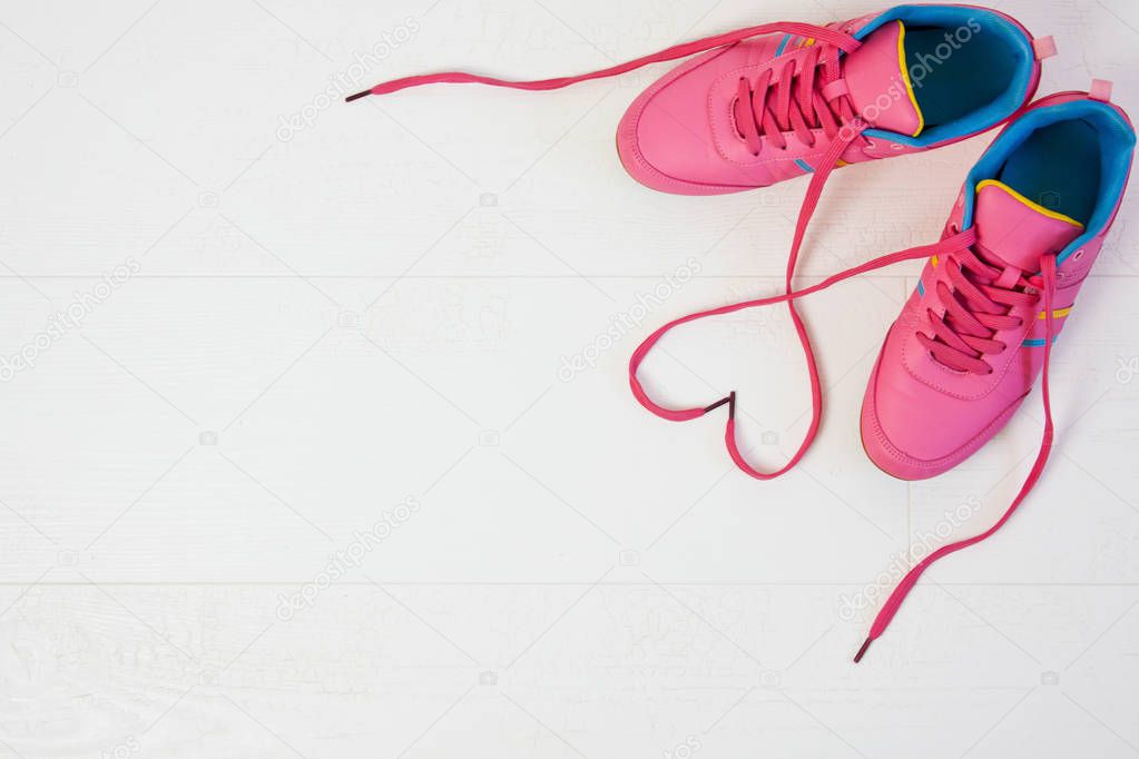 Beautiful women's sports sneakers with heart-shaped laces
