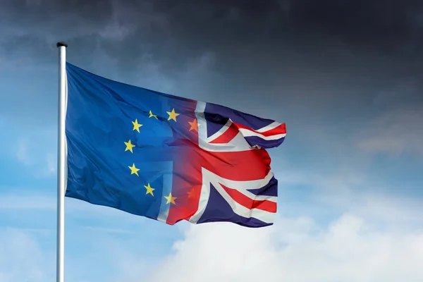 Merging European British Flag Front Dark Clouds Sky Symbol Brexit — Stock Photo, Image