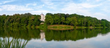 park panorama with the small river in the city ofBogoroditsk in clear summer day clipart