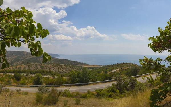 Panorama of the twisting road in mountains on the coast — Stock Photo, Image