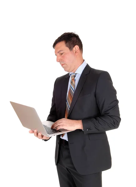 Tall Business Man Standing Dark Suit Tie Holding His Lapto — Stock Photo, Image