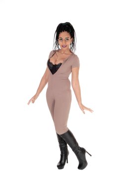 A beautiful young woman standing in a beige body suit and blac clipart