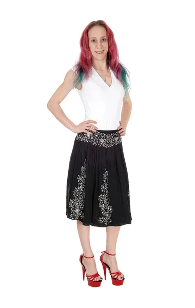 Young woman standing in a black skirt and white blouse — Stock Photo, Image