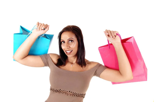 Primer plano de la mujer en vestido sosteniendo sus bolsas de la compra hasta —  Fotos de Stock