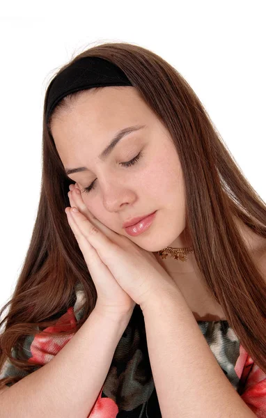 Durmiendo joven adolescente en sus manos — Foto de Stock