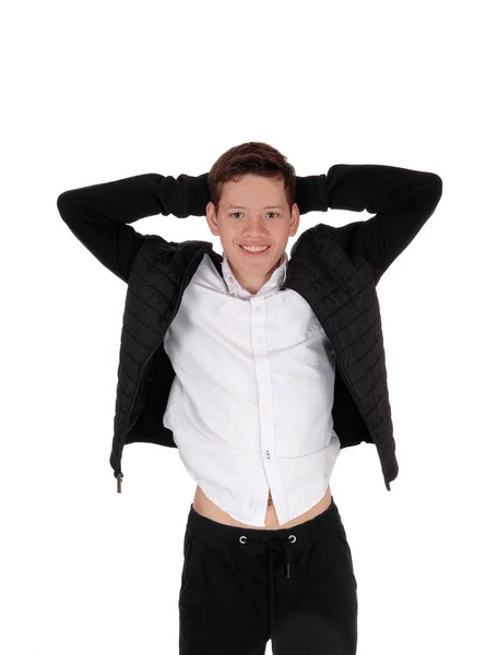 Happy teenager boy standing in a black jacket — Stock Photo, Image