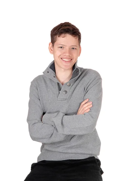 A happy and relaxed teen boy sitting on a chair — Stock Photo, Image