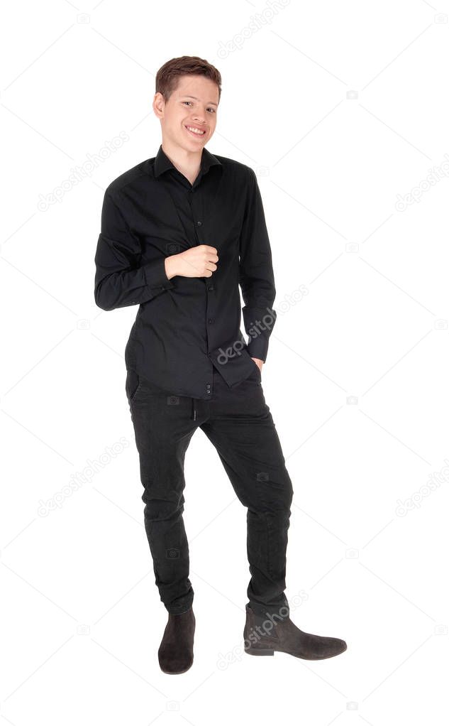 Young handsome teenager boy standing in a black outfit