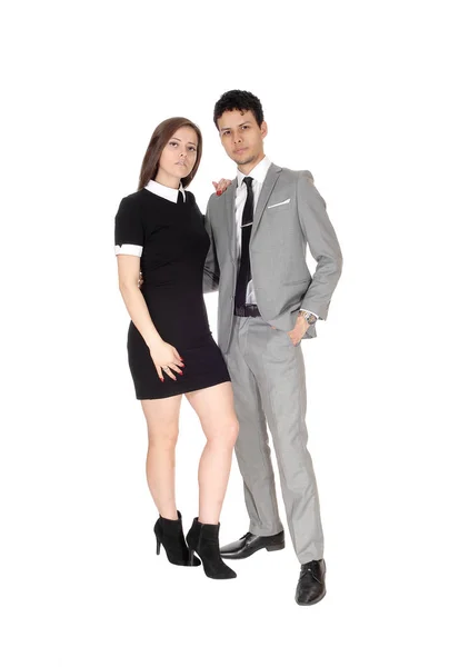 A beautiful young couple standing smiling in the studio — Stock Photo, Image