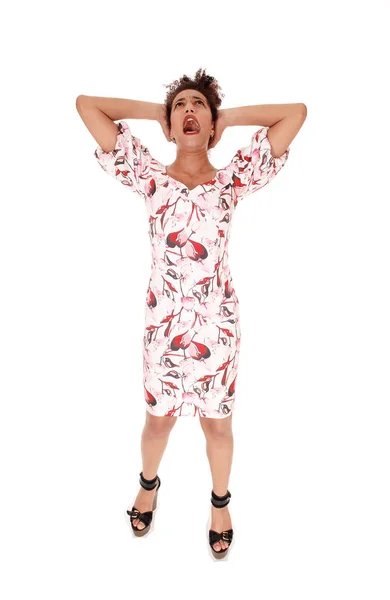 Screaming young woman standing in a dress — Stock Photo, Image