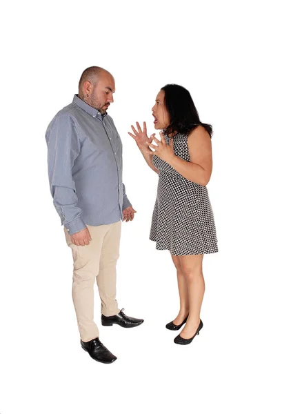 Fighting couple standing across each other in the studio — Stock Photo, Image