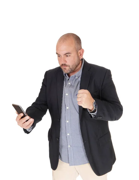 Suspired man looking at his cell phone — Stock Photo, Image