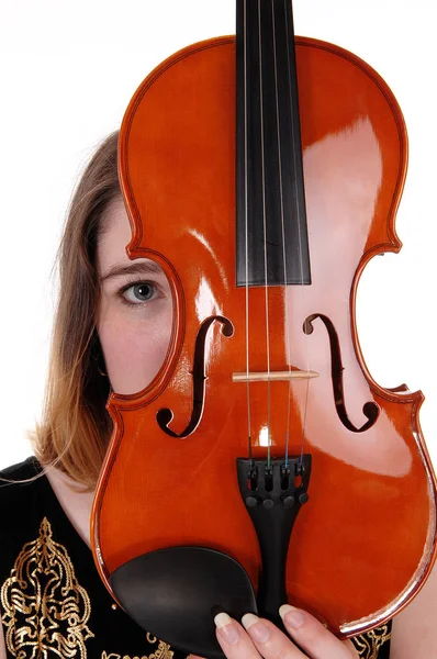 Woman hiding behind a violin — Stock Photo, Image
