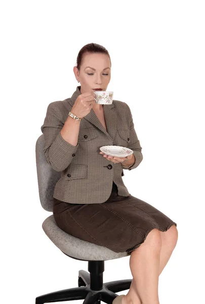 Business woman sitting with a cup of coffee — Stock Photo, Image
