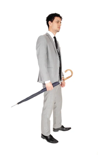 Young handsome man standing with a umbrella — Stock Photo, Image