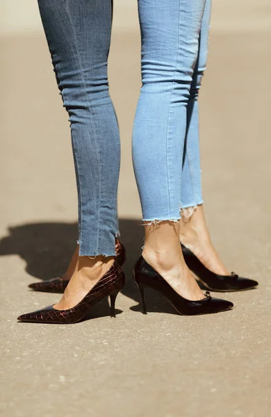 Heels and blue jeans Stock Photo