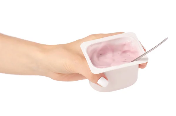 Yogurt con un cucchiaio in mano — Foto Stock