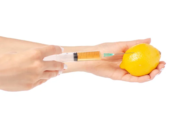 Syringe in the hands of lemon — Stock Photo, Image