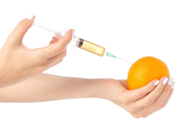 In de handen van Oranje syringe — Stockfoto