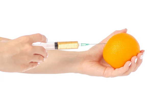 In de handen van Oranje syringe — Stockfoto