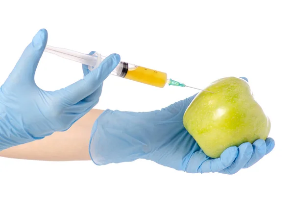 In de handen van een appel syringe — Stockfoto