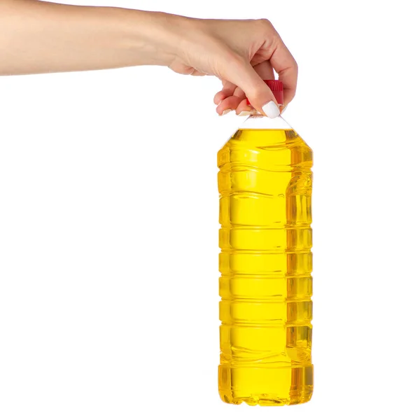 Fles zonnebloemolie in de hand — Stockfoto