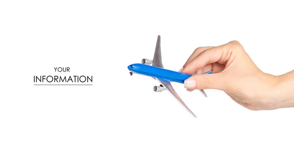 Avião em miniatura no padrão de viagem manual — Fotografia de Stock