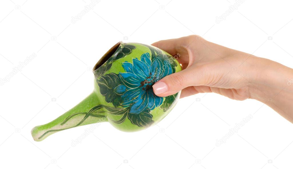The neti pot in hand