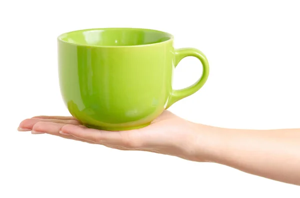 Taza de taza verde en la mano — Foto de Stock