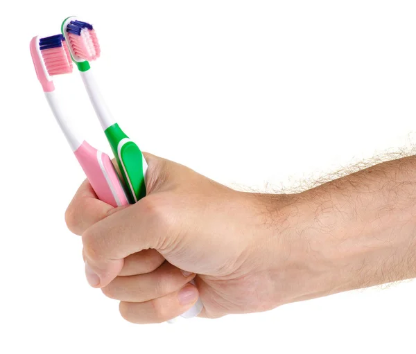 Two toothbrushes in hand — Stock Photo, Image