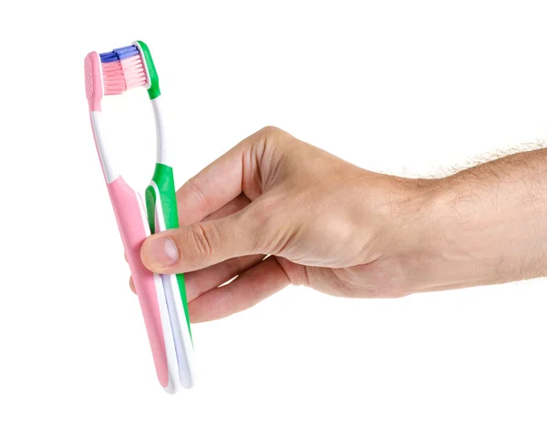 Two toothbrushes in hand — Stock Photo, Image