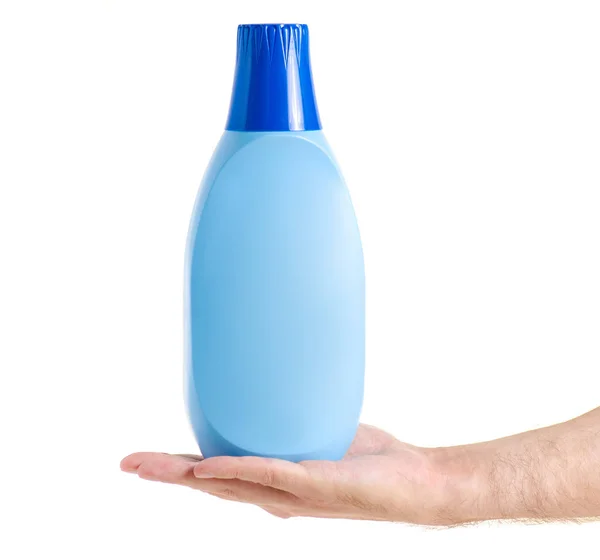 Botella con el acondicionador para ropa de lino en la mano — Foto de Stock